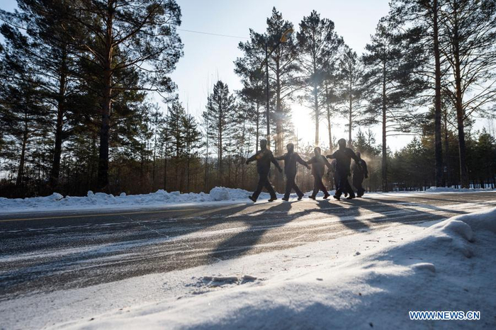 Firefighters exercise in Beiji Village of Mohe City, northeast China's Heilongjiang Province, Jan. 13, 2021. Firefighters stick to their post and keep training despite the freezing weather in Mohe, the northernmost city in China, where the temperature is often below minus 40 degrees Celsius in winter. (Xinhua/Xie Jianfei)