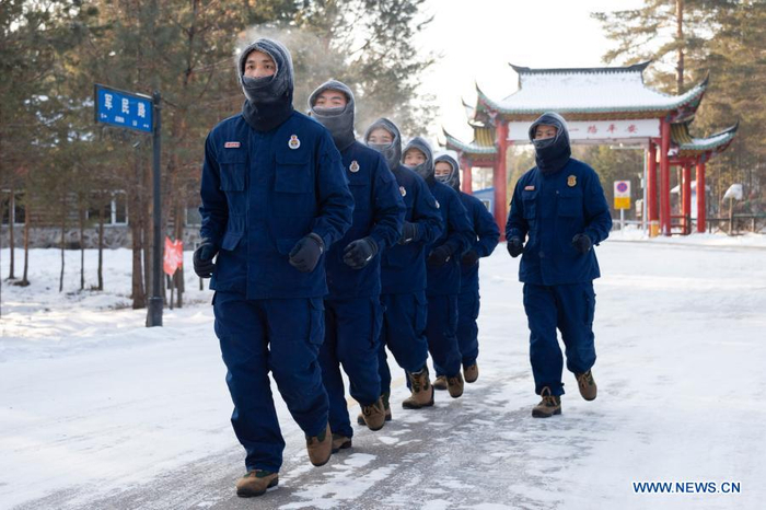 Firefighters exercise in Beiji Village of Mohe City, northeast China's Heilongjiang Province, Jan. 13, 2021. Firefighters stick to their post and keep training despite the freezing weather in Mohe, the northernmost city in China, where the temperature is often below minus 40 degrees Celsius in winter. (Xinhua/Xie Jianfei)