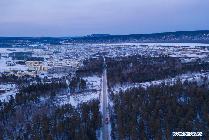 Aerial photo shows a fire engine patrolling on a road in Beiji Village of Mohe City, northeast China's Heilongjiang Province, Jan. 13, 2021. Firefighters stick to their post and keep training despite the freezing weather in Mohe, the northernmost city in China, where the temperature is often below minus 40 degrees Celsius in winter. (Xinhua/Xie Jianfei)
