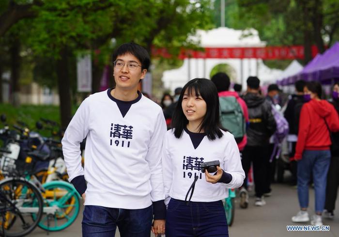 People walk at Tsinghua University in Beijing, capital of China, April 24, 2021. Tsinghua University will commemorate its 110th anniversary on April 25. (Xinhua/Xing Guangli)