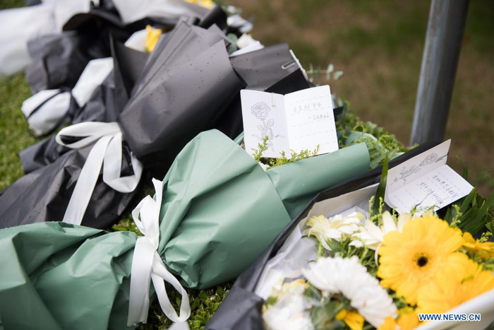 Flowers are placed by citizens to pay homage to deceased China's top hepatobiliary surgeon Wu Mengchao at the Longhua funeral parlor in east China's Shanghai, May 26, 2021. A memorial service for Wu Mengchao, known as the 