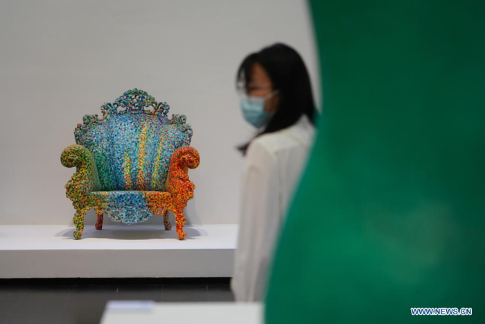 A woman visits an exhibition in Tsinghua University Art Museum in Beijing, capital of China, June 3, 2021. Displaying a total of 158 modern designs, the exhibition named 