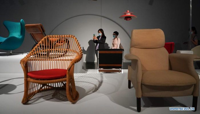 People visit an exhibition in Tsinghua University Art Museum in Beijing, capital of China, June 3, 2021. Displaying a total of 158 modern designs, the exhibition named 