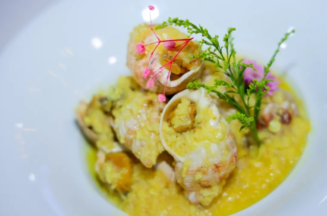 亚军作品：禧宴·福钥融合海鲜坊奶油蒜香白螺（企业供图，央广网发）