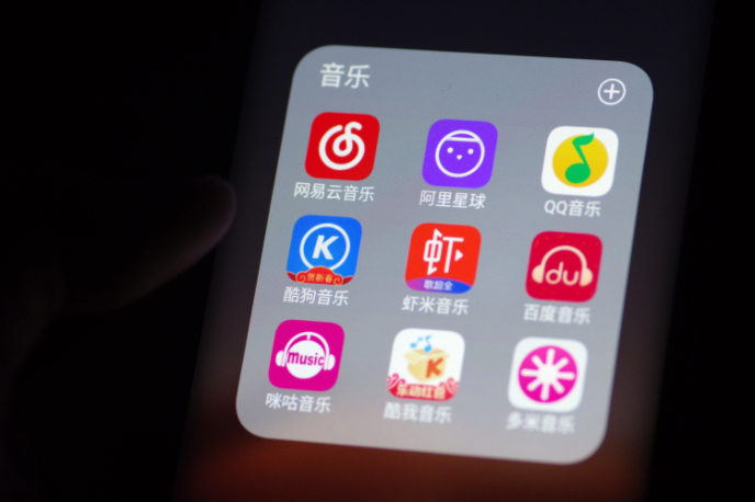 ▲用户手机里跟音乐有关的APP应用越来越多，若短视频平台入局，平台竞争将更为激烈。图/IC