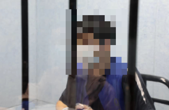 被告人正在接受审讯  检察机关 供图