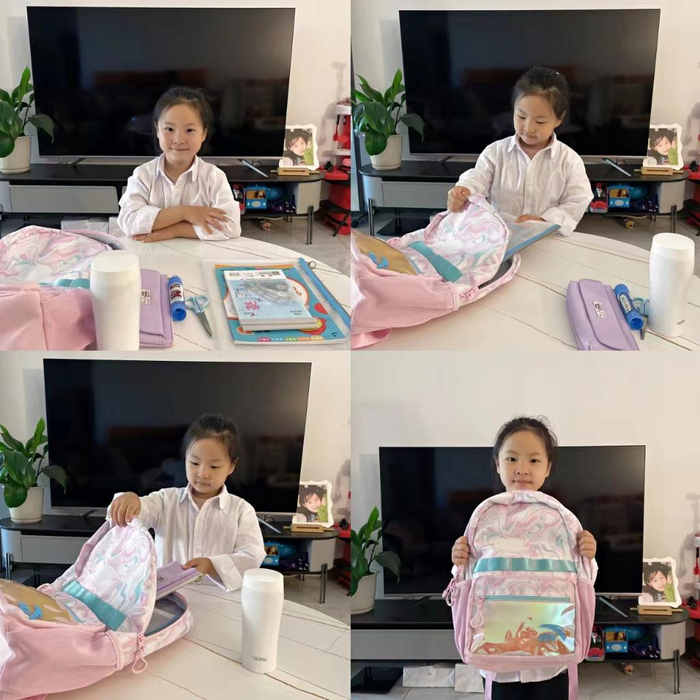 线上课堂中，哈尔滨新区第一学校一名一年级学生整理书包