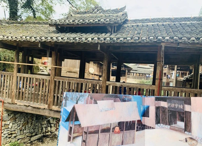 绘本《找金鸡》融合了侗族传统建筑、风俗传说等