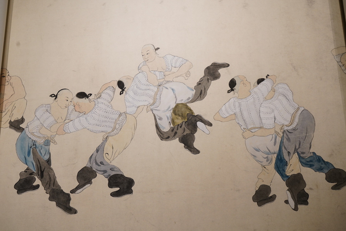 展示市民文化的清代《摔跤图》局部
