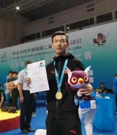 马衣姑在全国第二届青运会武术散打中夺冠，受访者供图