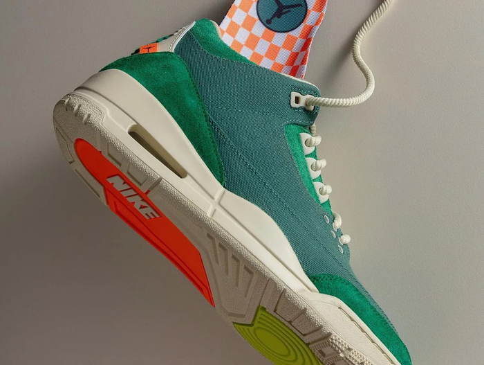 简笔画风格的jumpmanlogo,出现在鞋舌,吊牌和鞋盒上,彰显ninachanel