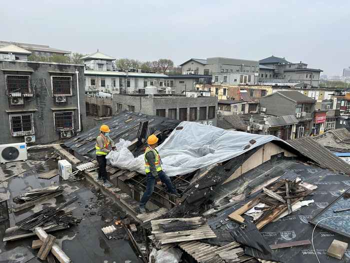 北京前门起火面馆二层违建开始拆除将恢复平房原貌