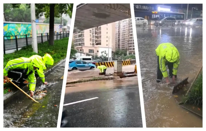 在长沙城区积水路段，交警身穿雨衣在积水路段徒手清理被堵塞的下水管道，加快积水排放。