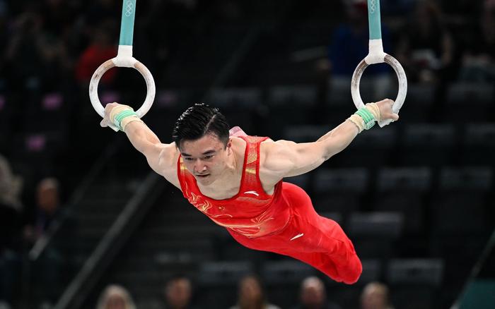 从东京到巴黎，刘洋蝉联体操男子吊环项目金牌。 图/新华社