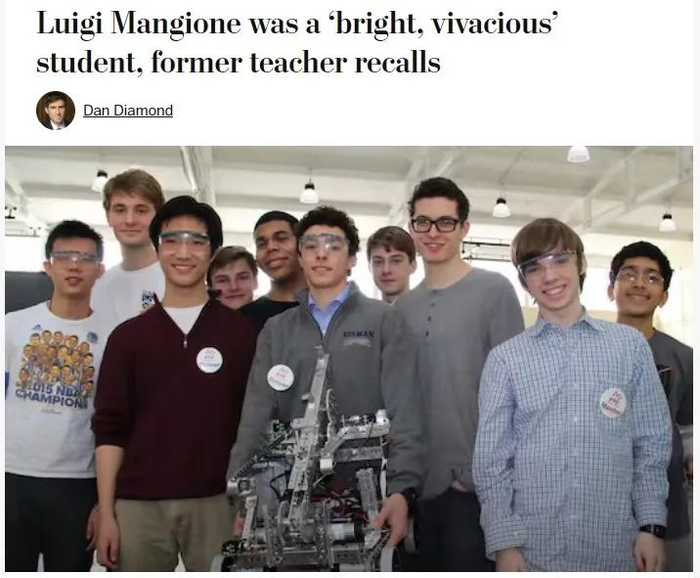 （图片最中间灰色夹克的就是Mangione）