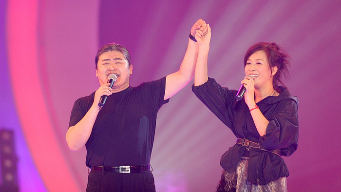 2006年7月13日,“志愿北京”演唱会，刘欢与那英。视觉中国 资料图