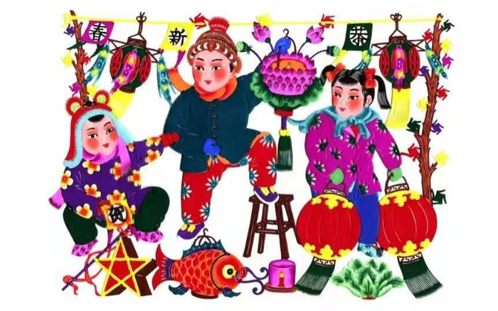 剪纸蹬着板凳挂彩灯。李宝峰供图