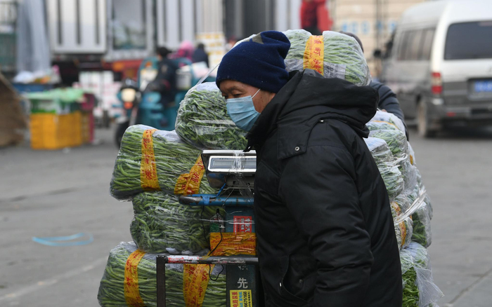 新发地市场卖豆角的商户。新京报记者 王颖 摄
