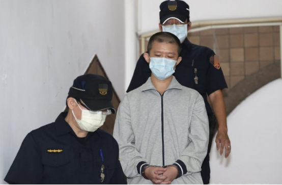 陈伯谦（前右）。图自台湾“中央社”