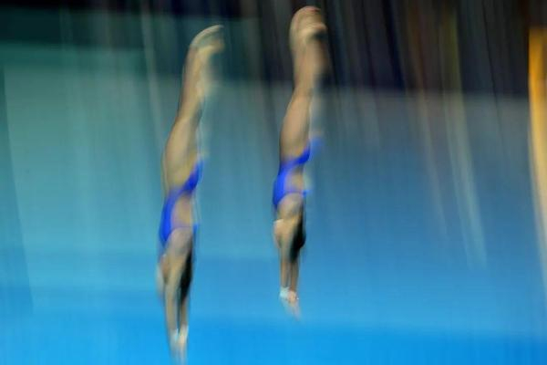 全红婵/陈芋汐在比赛中，动作同步性高度一致。视觉中国供图