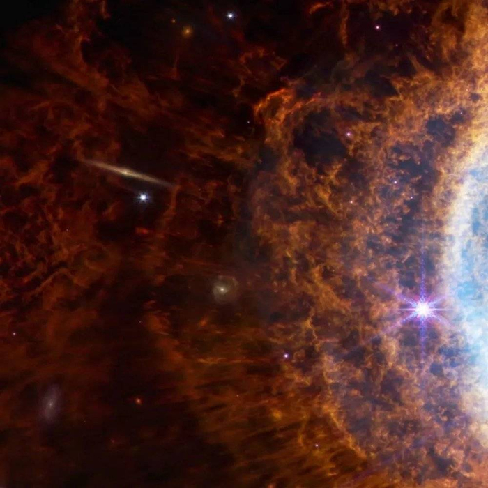 行星状星云 NGC 3132 局部，透过星云能看到更遥远的星系 | NASA/ESA/CSA/STScI