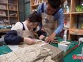 'Doctors' restore ancient books in Gansu
