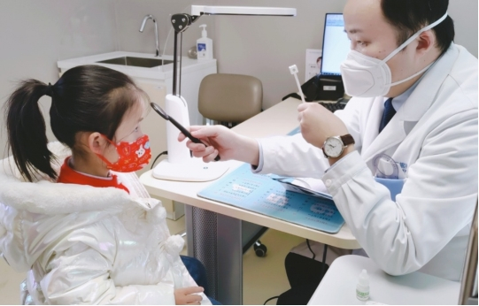 　　图：胡盼主任日常接诊