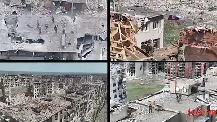 ↑士兵手持俄罗斯国旗在巴赫穆特多地庆祝