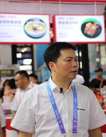 (图示2:现场采访广西柳工集团有限公司董事、副总裁、食品公司董事长王太平)
