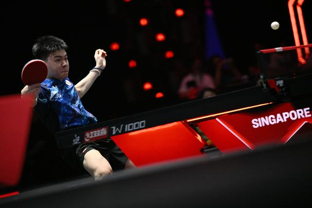 3月13日，中国台北选手高承睿在比赛中回球。新华社发（邓智炜摄）