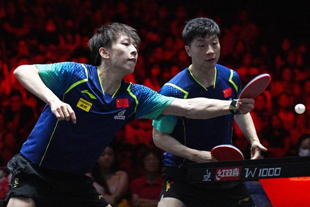 3月16日，林高远（左）/马龙在比赛中。新华社发（邓智炜摄）