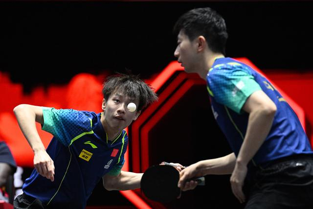 3月16日，林高远（左）/马龙在比赛中。新华社发（邓智炜摄）