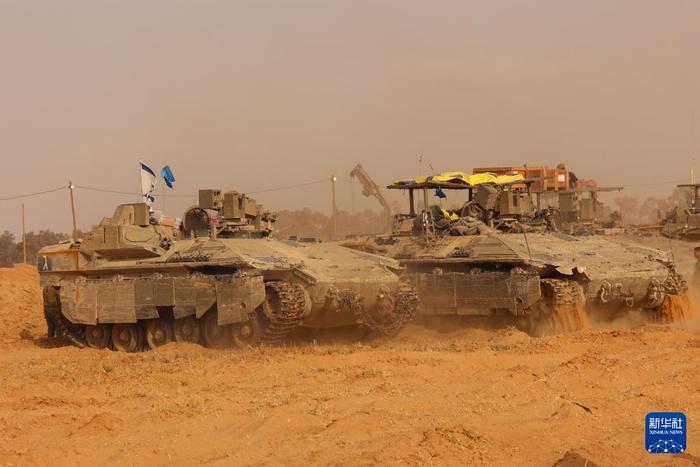   这是5月27日在以色列与加沙边境以方一侧拍摄的以军部队。新华社发（吉尔·科恩·马根摄）
