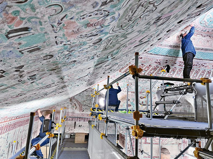 ▲莫高窟第55窟文物修复现场。敦煌研究院供图