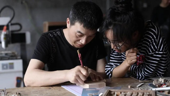 王法万教李子柒木活字印刷。受访者供图