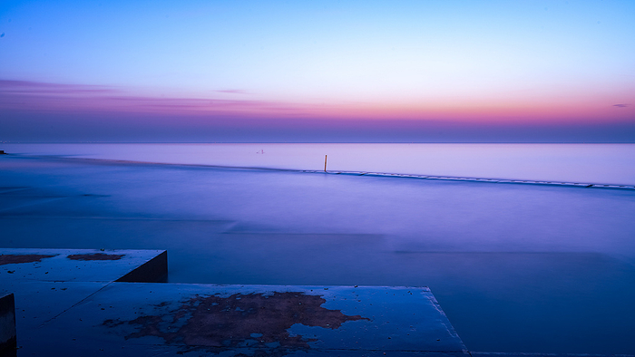 天津东疆港海滩日出（来源：CFP）