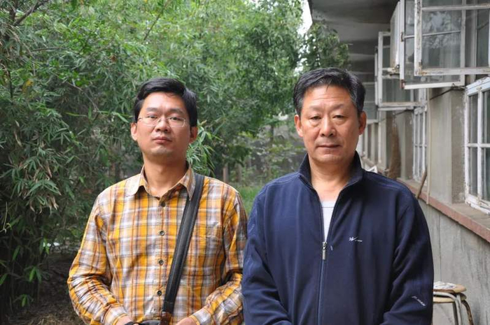 李力（右）与儿子李硕。