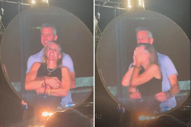 Astronomer首席执行官（CEO）安迪·拜伦搂抱公司人力资源总监（HR）克里斯汀·卡伯特 图源：美媒