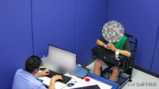 ▲办案民警审讯嫌疑人。上海静安警方供图