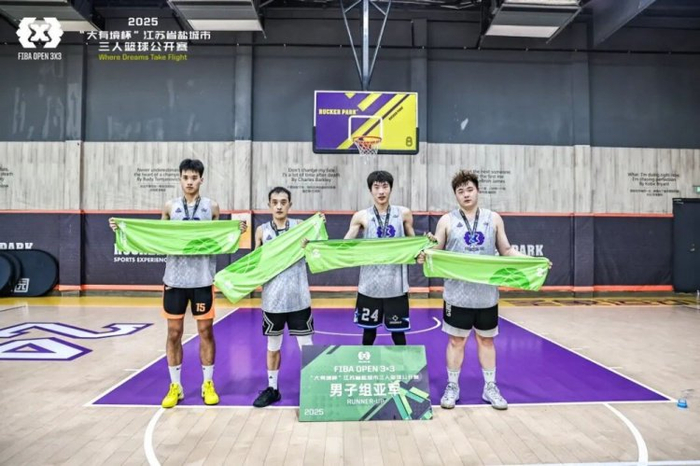 The winning team celebrates their victory in the 3x3 basketball tournament.