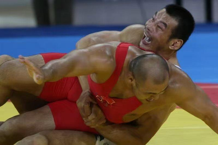 刘德利（上）在赛场上（图片由受访者提供）