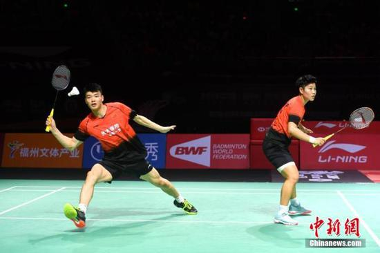  资料图：图为王懿律/黄东萍在比赛中。中新社记者 吕明 摄