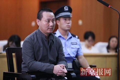 房山法院，被告人田某，正在法庭上接受询问。新京报记者 尹亚飞 摄
