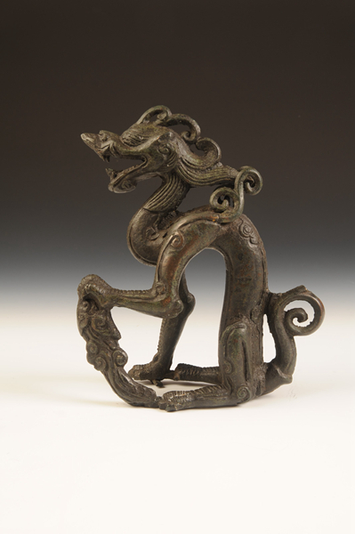 金代铜坐龙。来源：黑龙江省博物馆网站