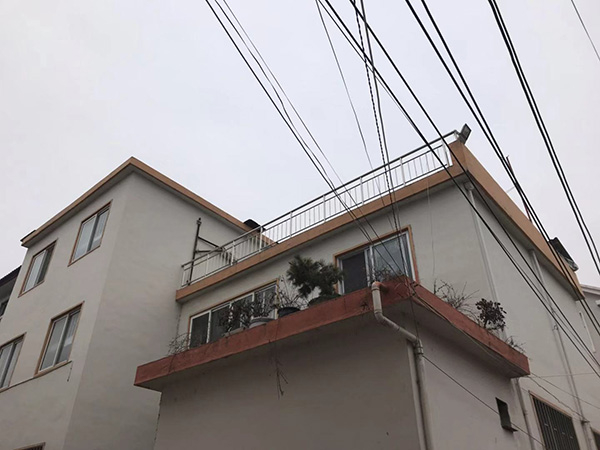 常浩（化名）为家里建的楼房。澎湃新闻记者 何利权 图