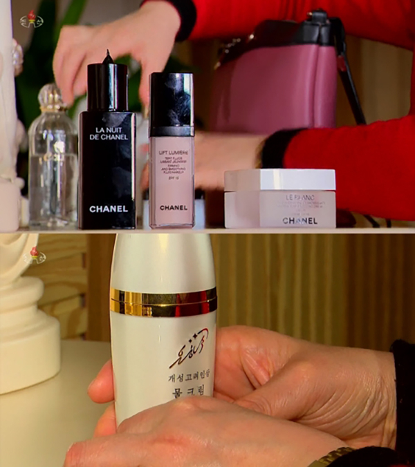 据朝鲜中央电视台3月21日报道，一名朝鲜居民在收拾香奈尔化妆品后，把银河化妆品放在妆台中间。