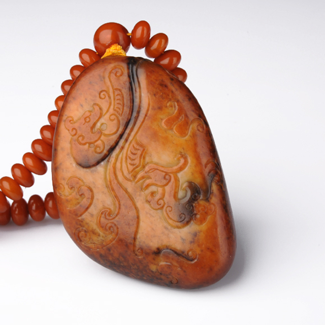 267仿古龙凤把件 和田籽料沁色黄玉 30,000