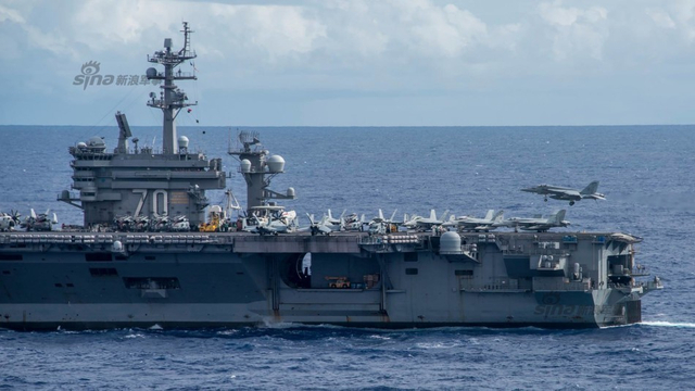 美国航母自称第16次进入南海 解放军一行动回击